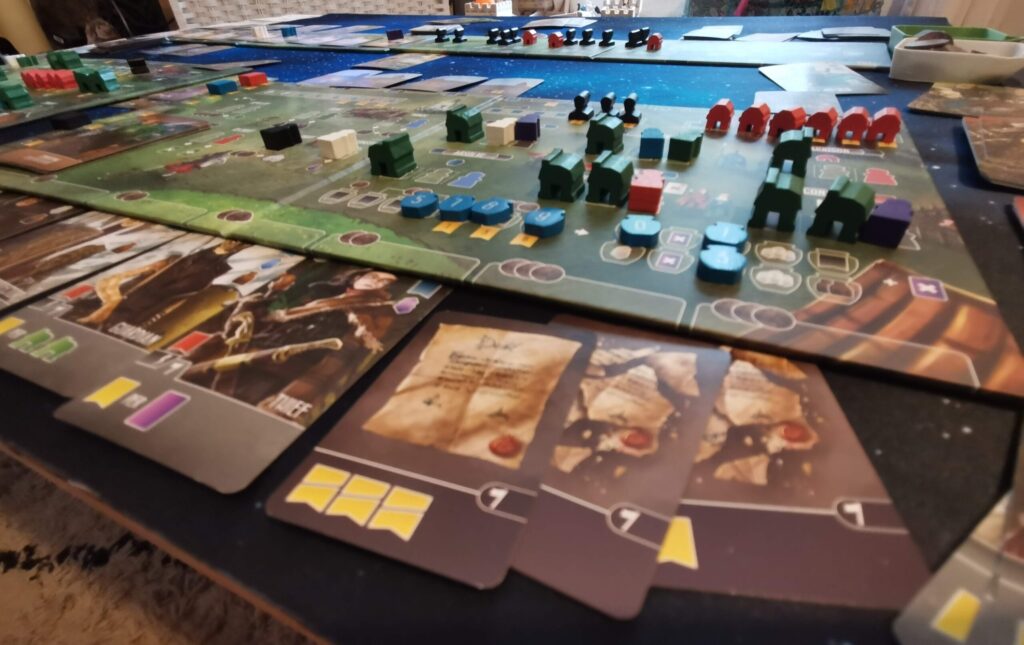 a close-up of the Paladins of the West Kingdom player board and cards